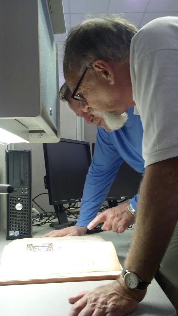 Al Shoaf and John Van Hook examine the facsimile